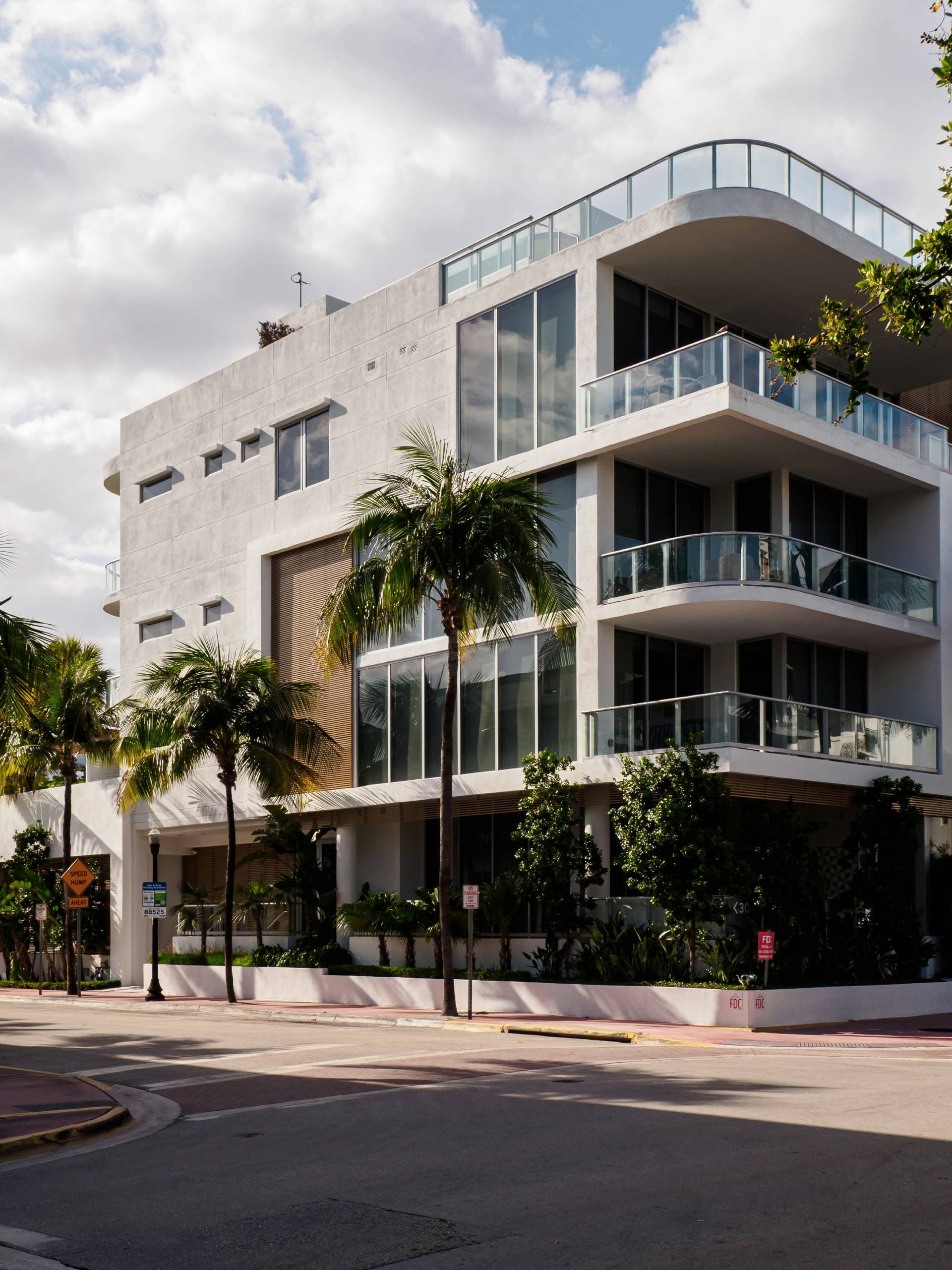 South Florida commercial property with palm trees served by First American Arborists
